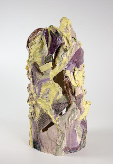 Abstract ceramic sculpture with a rough, layered surface in yellow, purple, and neutral tones.