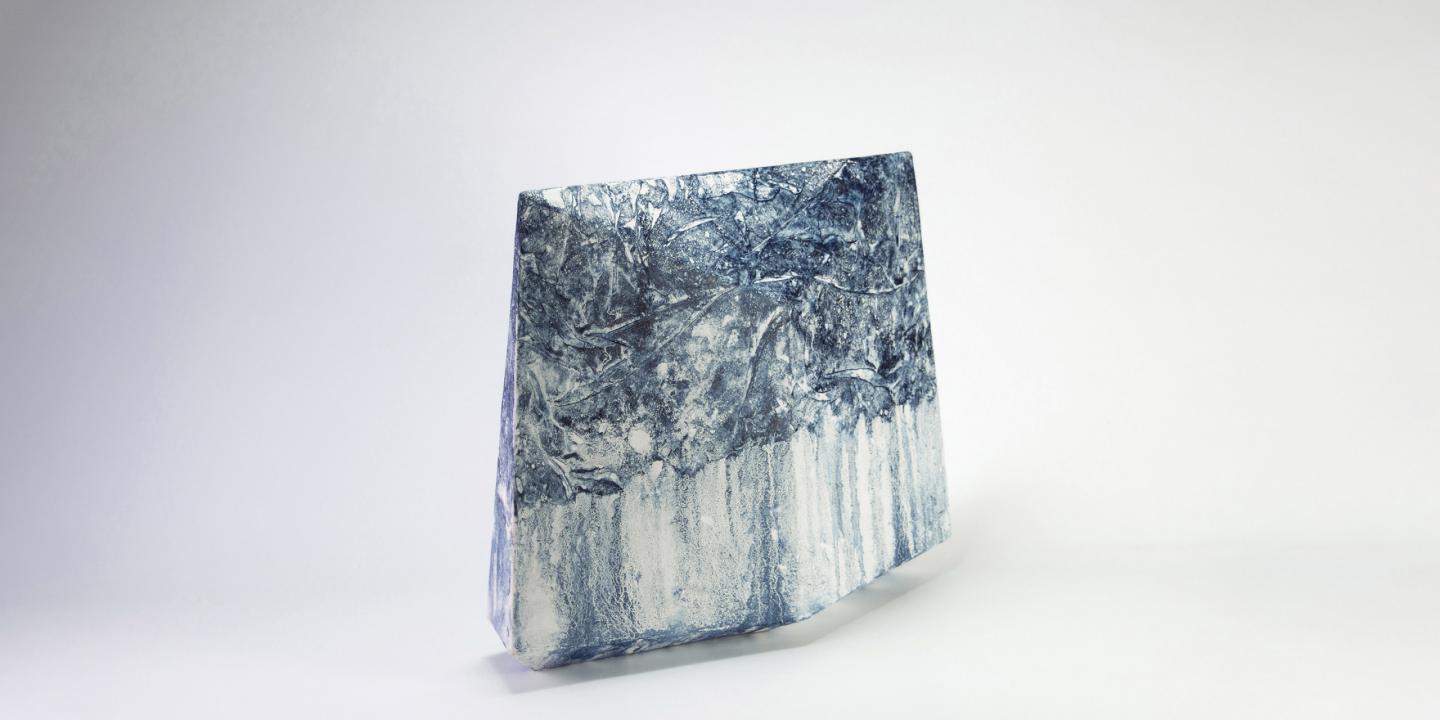 Abstract black-and-white composition with concentric, wavy lines and a dark, intertwined form in the center.