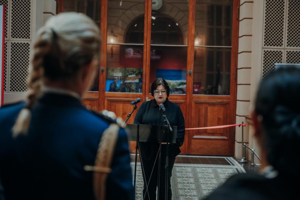 A woman delivers a speech during the exhibition opening at the Art Museum RĪGAS BIRŽA.