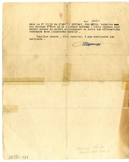Folded yellowed typewritten letter with French text, blue handwritten corrections and a signature.