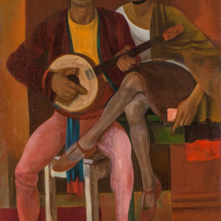 A woman and a man with a guitar