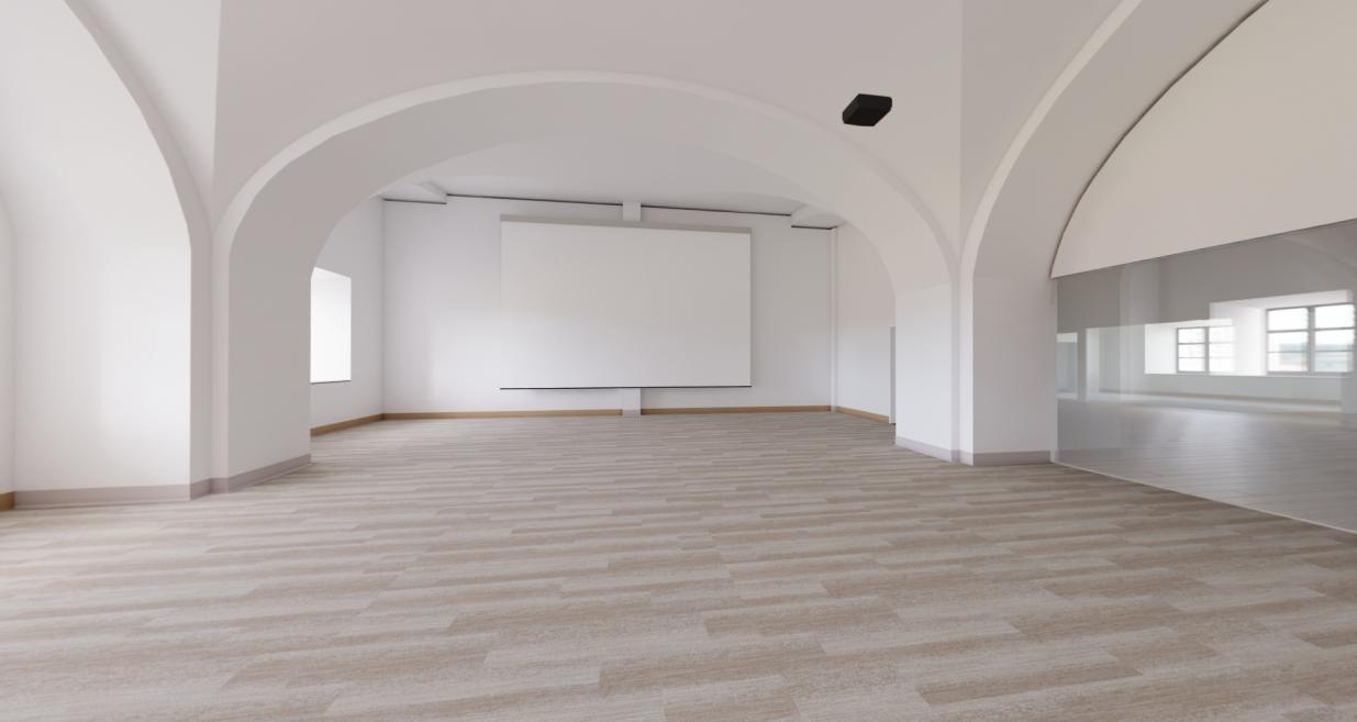 Bright room with a large screen and light-colored flooring in the museum building.