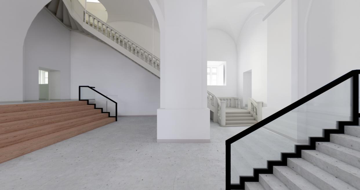 Spacious museum lobby with staircases and high white vaulted ceilings.