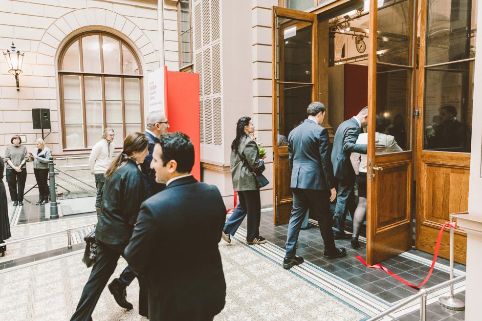 Guests enter the indoor space after the ribbon-cutting ceremony.