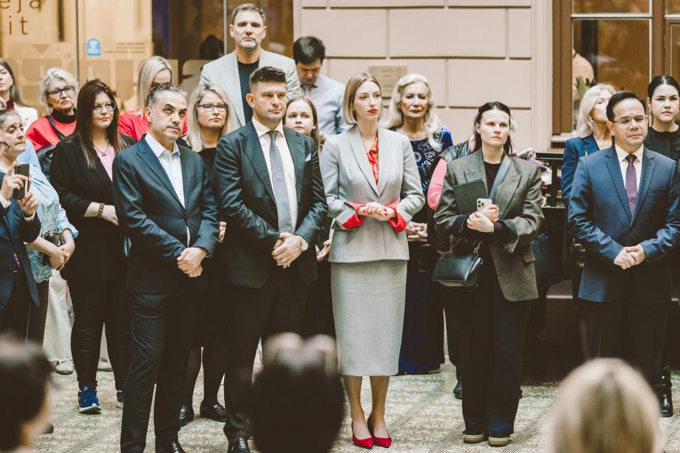 Audience listens to a speech during the formal event.