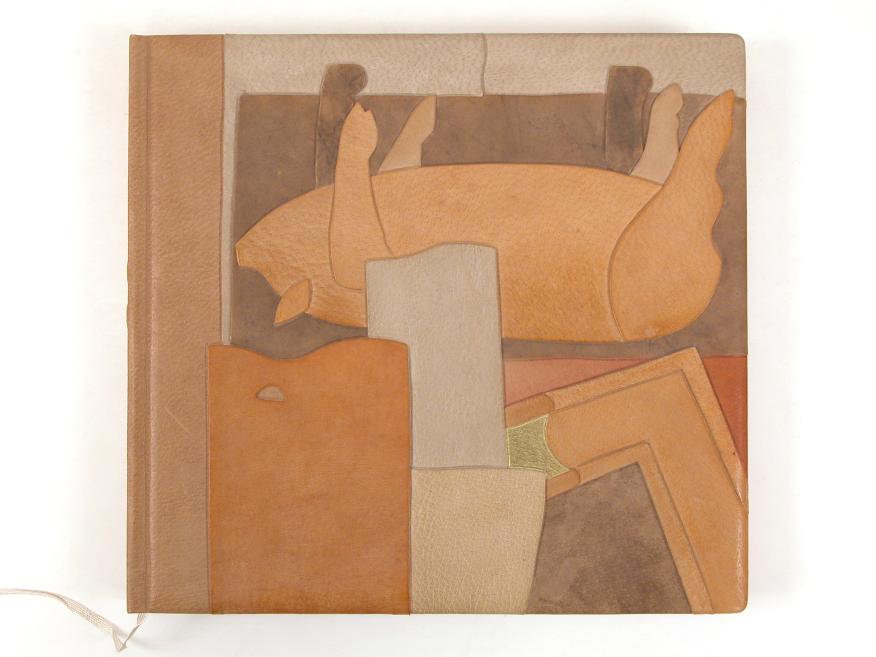 Abstract composition on a book or album cover, made of geometric leather or paper fragments in shades of brown, beige, and orange.