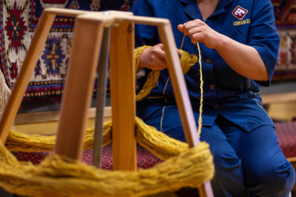 Weaver's hands weaving.