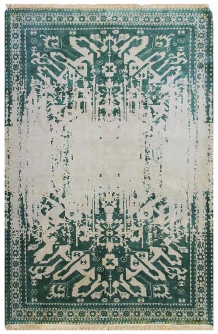 Close-up of a woven carpet in shades of green.