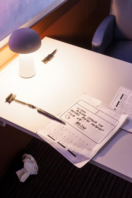 Documents on the table in a train compartment