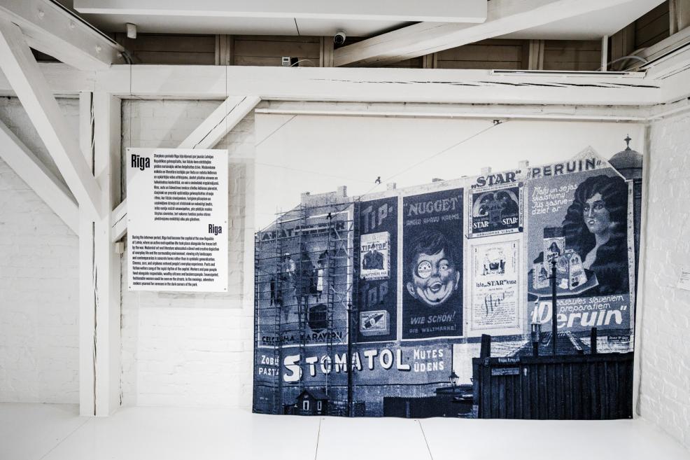 Exhibition display fragment with a historical photograph of Riga.