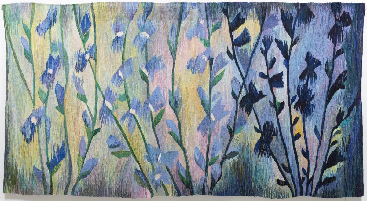 A colorful tapestry depicting stylized blue and purple flowers on green stems against a pastel background.