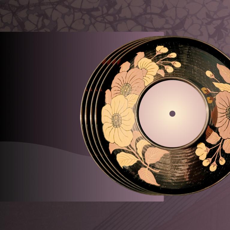 Decorative vinyl record with floral patterns on a dark surface, placed against a stylized purple background with plant shadows.