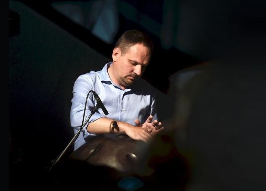 A musician plays a percussion instrument during the concert programme of the event “Together on the Path to Inclusive Culture”.