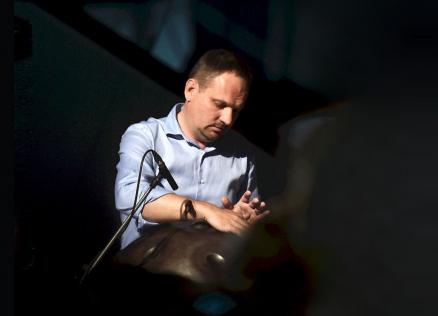 A musician plays a percussion instrument during the concert programme of the event “Together on the Path to Inclusive Culture”.