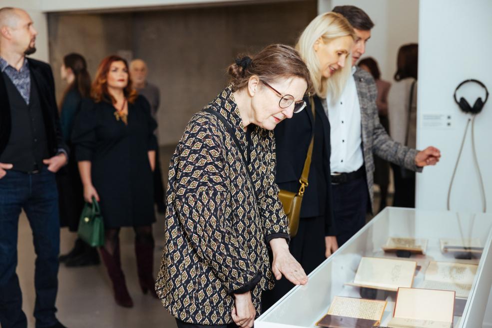 Visitors view the work in the showcase