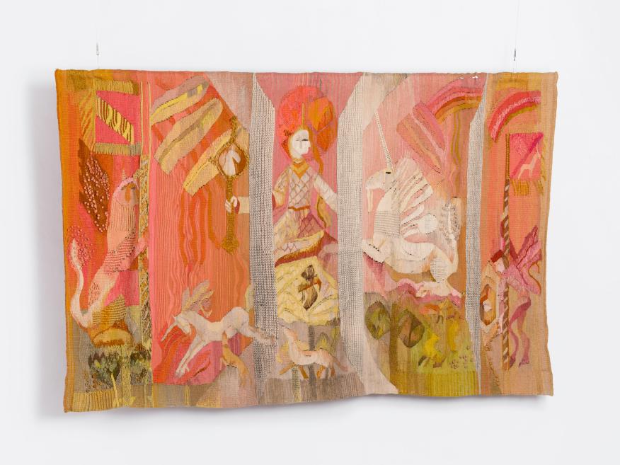 Colorful textile mosaic wall work with stylized human figures and geometric patterns in pink, orange, and beige tones.