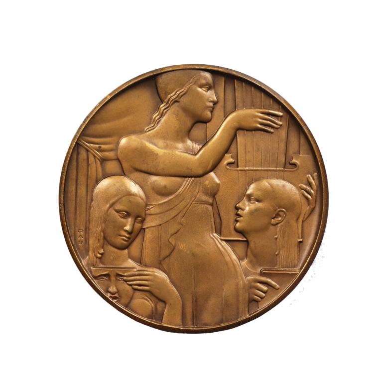 A bronze medallion in relief depicting a female figure and two stylized portraits beside a lyre-like instrument.