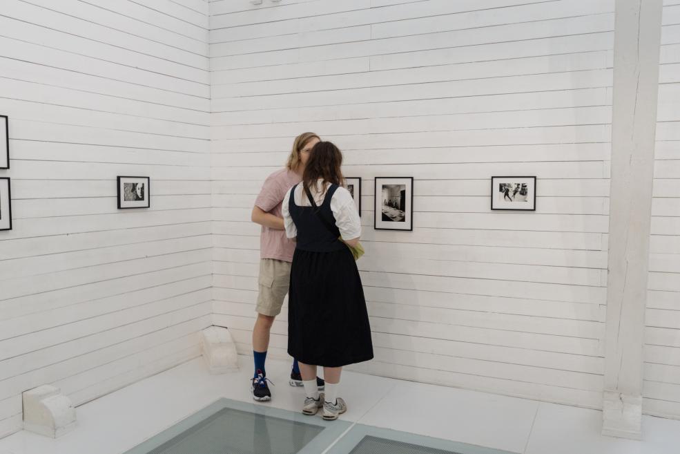 Visitors view the works at the opening of the exhibition.