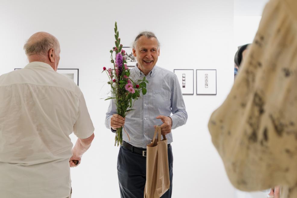 Jānis Deinats at the opening ceremony of the exhibition.