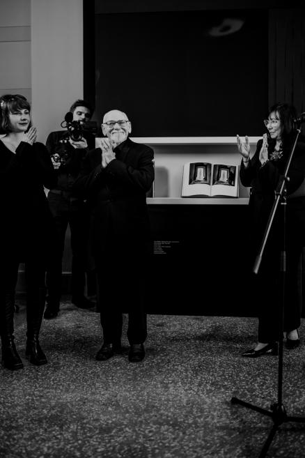 Black and white image of Gunnar Bindi and his daughters at the opening ceremony.