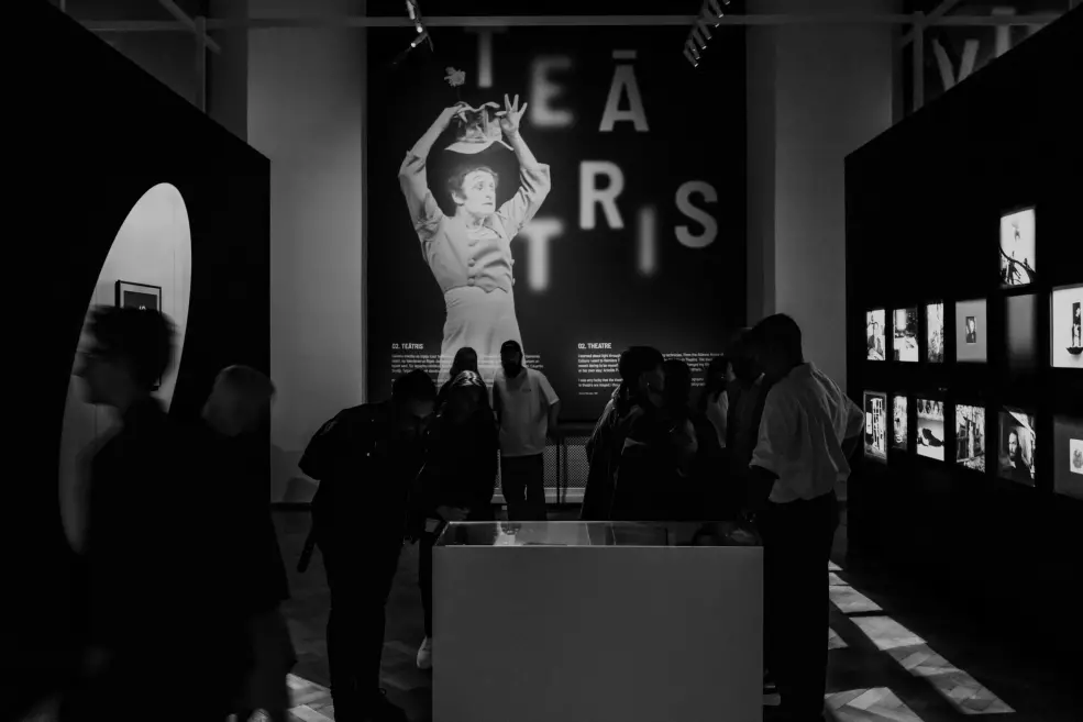 Black and white image with visitors at the opening of the exhibition.