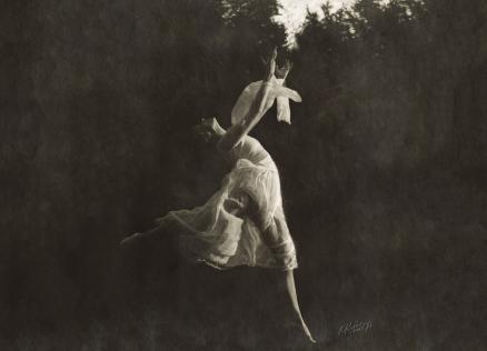 Black and white photo of a ballerina dancing.