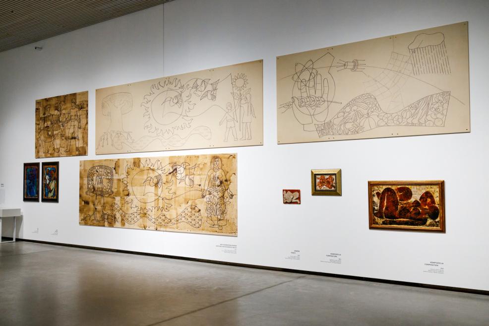 Exhibition wall displaying several large-scale drawings and paintings by Ojārs Ābols, arranged in a cohesive composition on a white gallery wall.