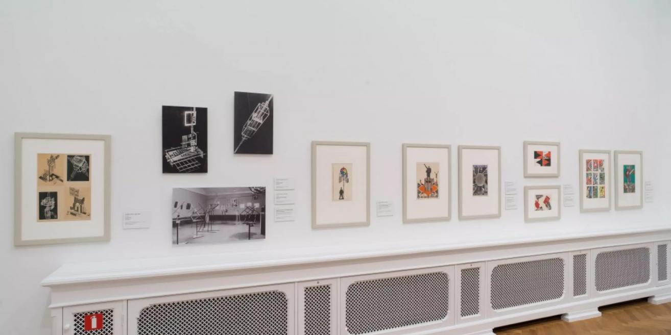 Exhibition at the Latvian National Museum of Art showcasing avant-garde graphic and design sketches.