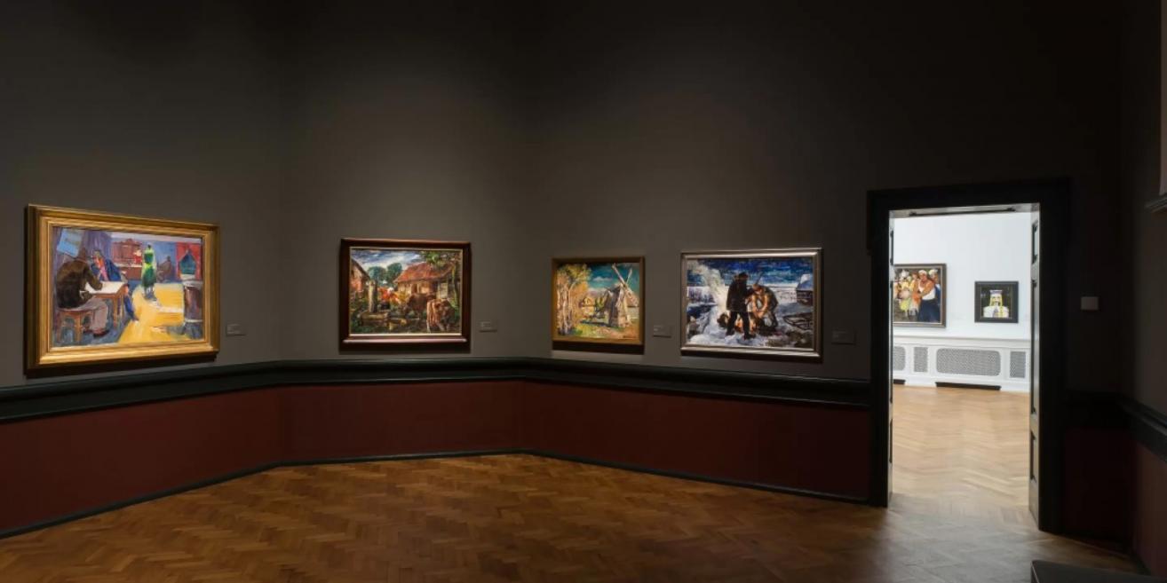 Exhibition view at the Latvian National Museum of Art with 20th-century Latvian landscapes and genre scenes.