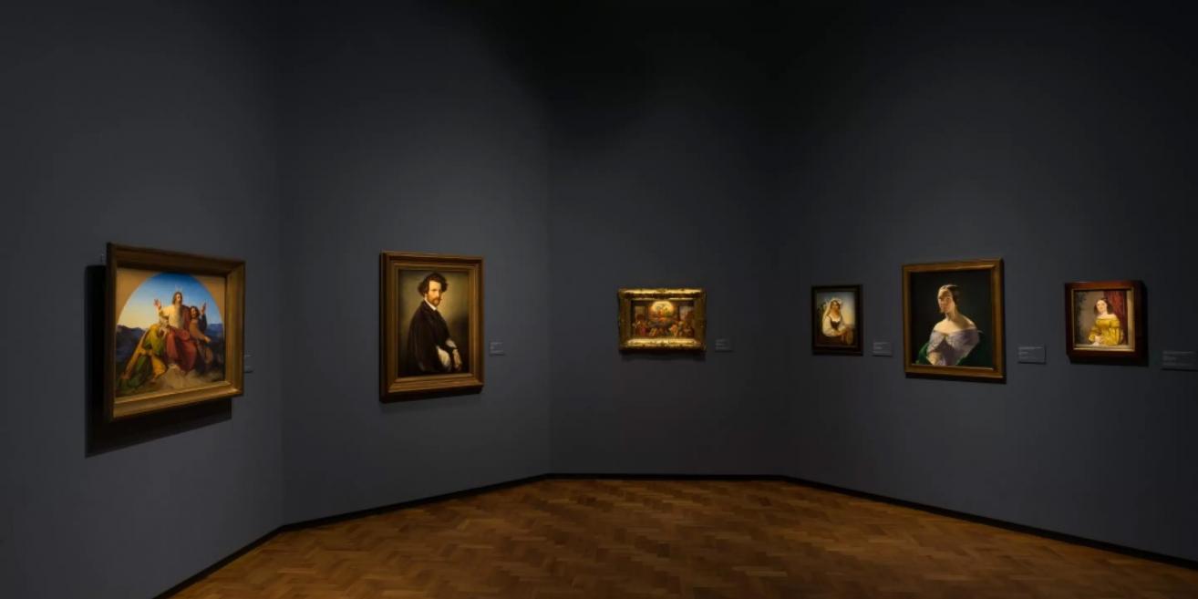 Gallery of the Latvian National Museum of Art showcasing 19th-century portraits and religious-themed paintings.