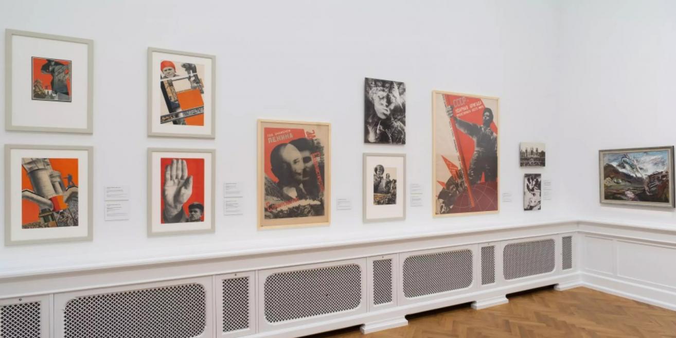Exhibition wall at the Latvian National Museum of Art with Soviet-era posters and photomontages.