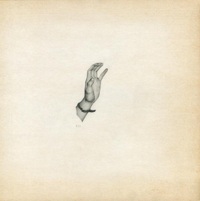 Against a light background, a detailed drawing shows a raised human hand with a bracelet around the wrist.