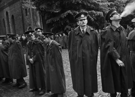 Black and white image of police officers in coats.