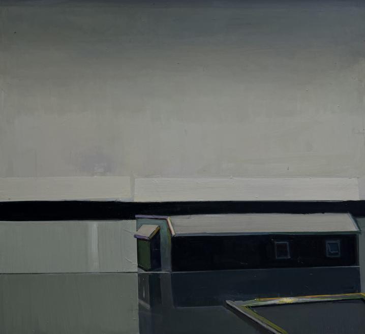 A minimalist composition shows a low building with a dark roof and small windows in a quiet grey-blue landscape with water reflecting in the foreground.