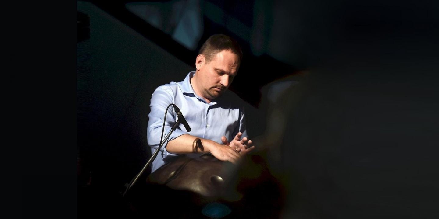 A musician plays a percussion instrument during the concert programme of the event “Together on the Path to Inclusive Culture”.
