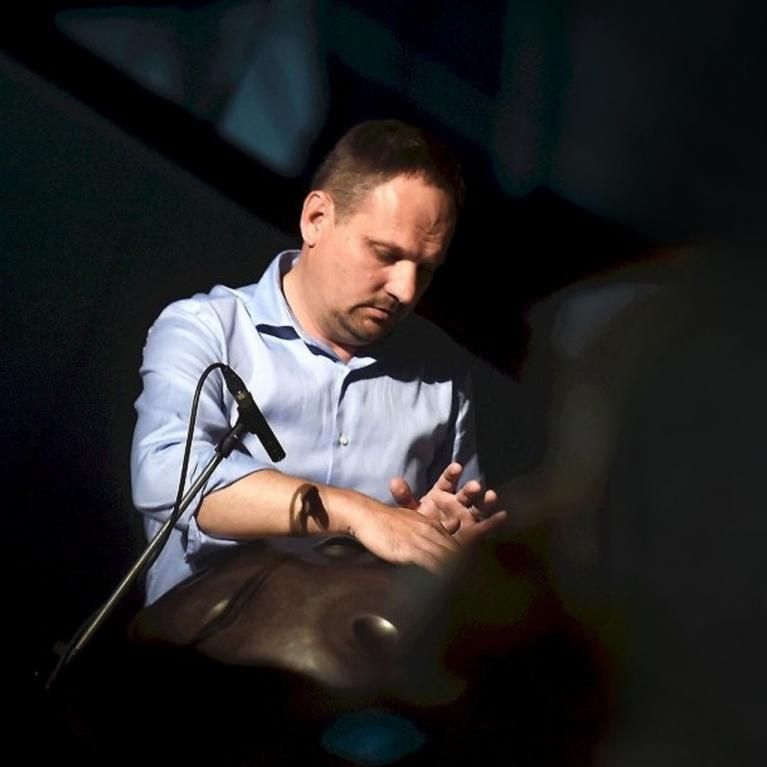 A musician plays a percussion instrument during the concert programme of the event “Together on the Path to Inclusive Culture”.