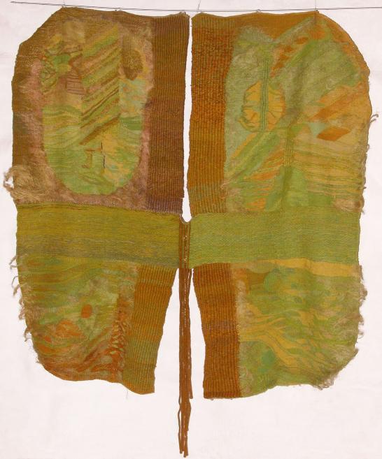 Two-panel textile artwork in green and ochre tones with a symmetrical structure.