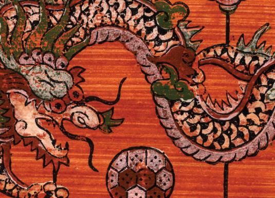 A detailed depiction of a Chinese dragon with scales and horns on a reddish background.