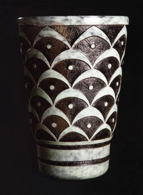 Vase made of smoked glass with a white glass outer layer, acid-etched with geometric patterns. 1923. Esterkin Family Collection. Publicity photo.