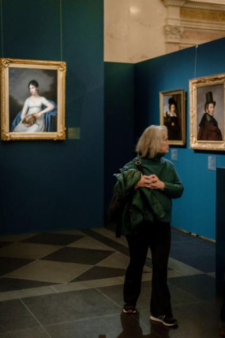 A visitor looks at the works of art in the exhibition.