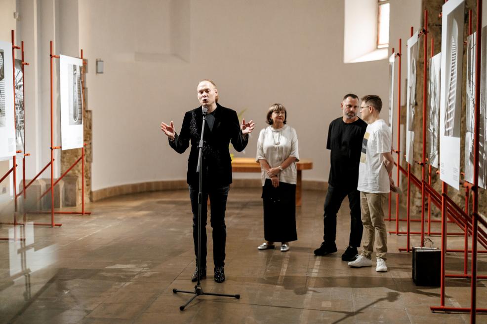 Man giving a speech at the exhibition opening.