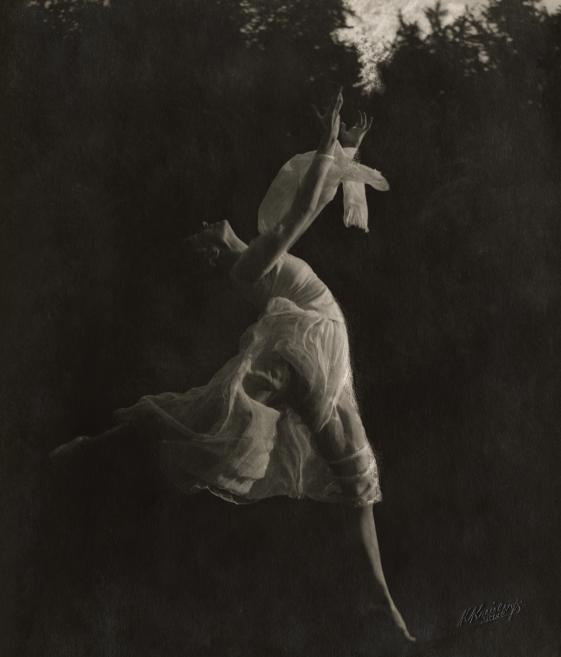 Black and white photo of a ballerina dancing.