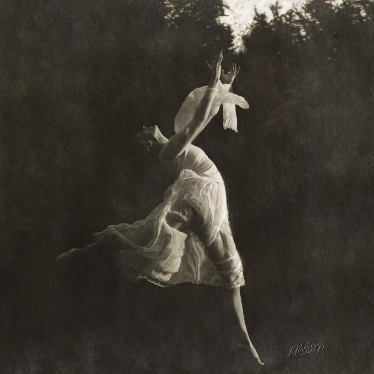 Dancer Beatrise Vīgnere. Portrait in profile, full length, as if flying, in a plastic dance pose, with bare feet, in the open air. Summer, 2nd half of the 1920s. Collection of the Literature and Music Museum. Photo: Kārlis Kreicbergs