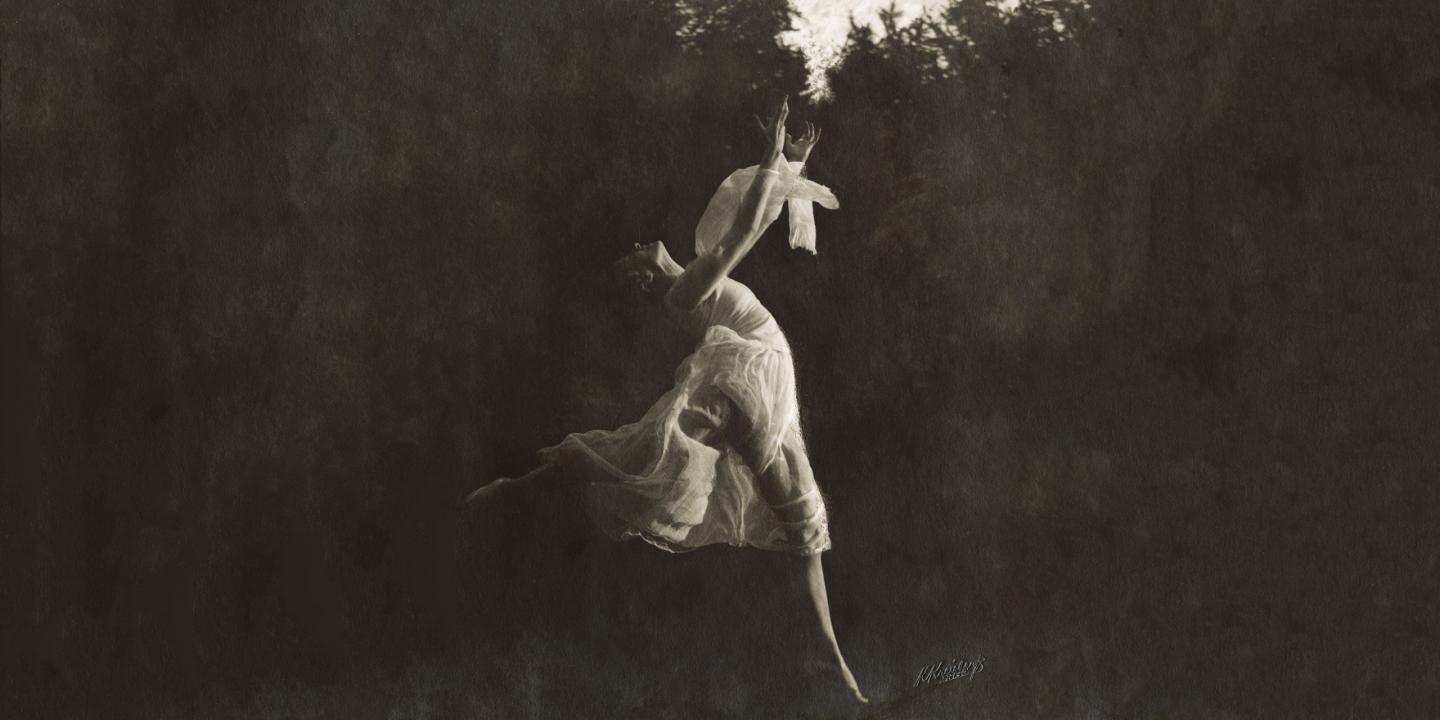 Black and white photo of a ballerina dancing.